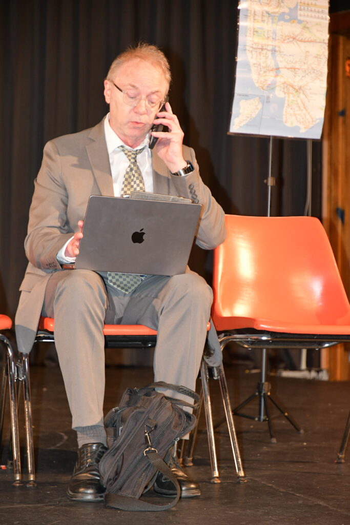 Man on phone with laptop